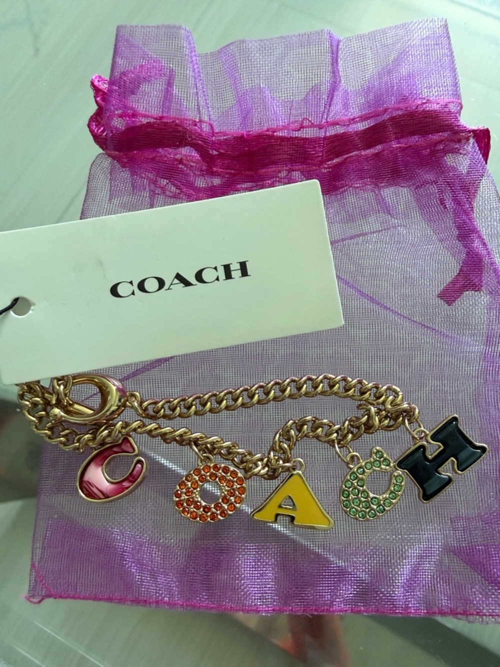 Coach Gold Charm Bracelet with Multicolored Enamel Letter Charms